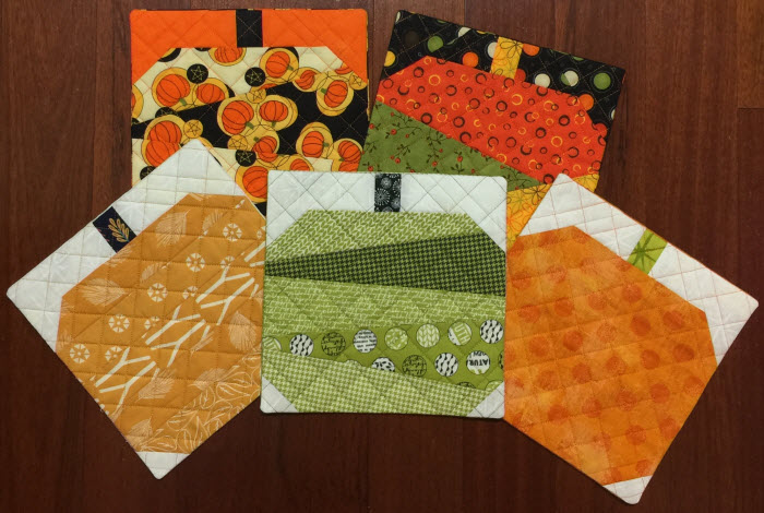 pieced pumpkins in the hoop trivets potholders