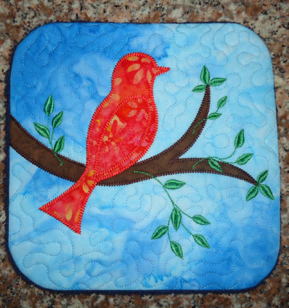 applique bird on a branch, kitchen trivet
